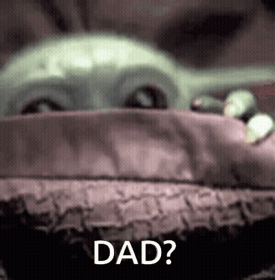 A Close Up Of A Baby Yoda With The Words `` Dad '' Written Next To It . GIF