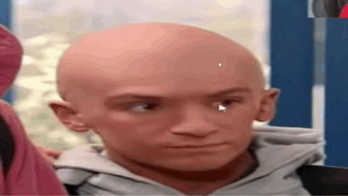 A Close Up Of A Bald Man 'S Face With A Arrow Pointing To His Eye . GIF