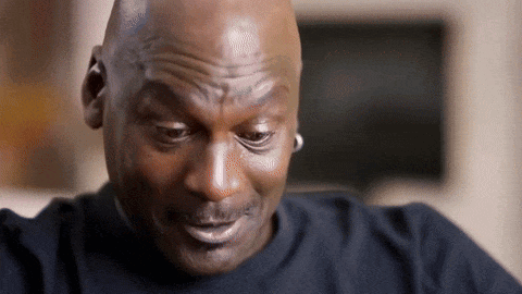 A Close Up Of A Bald Man 'S Face With A Slight Smile On His Face . GIF