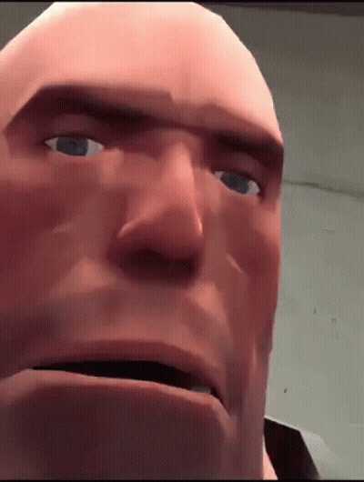 A Close Up Of A Bald Man 'S Face With Blue Eyes And A Serious Look On His Face . GIF