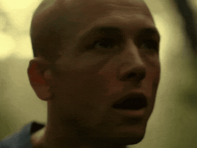 A Close Up Of A Bald Man 'S Face With His Mouth Open GIF