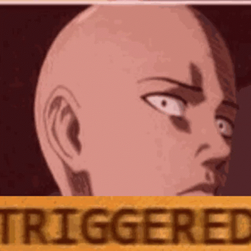 A Close Up Of A Bald Man 'S Face With The Words `` Triggered '' Written On It . GIF