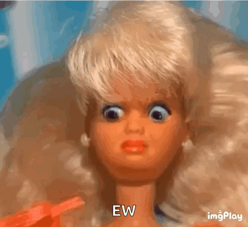 A Close Up Of A Barbie Doll Making A Funny Face And Saying Ew . GIF