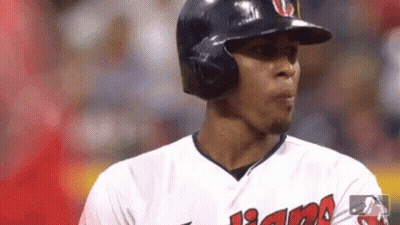 A Close Up Of A Baseball Player Wearing A Helmet And Sunglasses . GIF