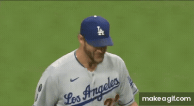 A Close Up Of A Baseball Player Wearing A La Hat On A Baseball Field . GIF