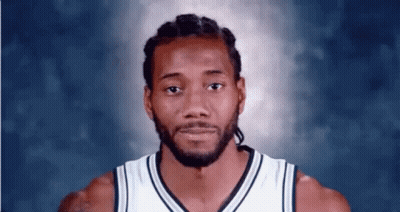 A Close Up Of A Basketball Player 'S Face Against A Blue Background . GIF