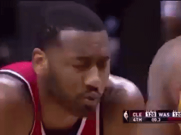 A Close Up Of A Basketball Player 'S Face During A Game GIF