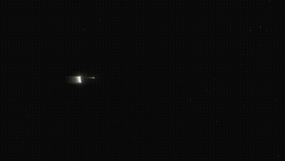 A Close Up Of A Batman Logo In The Dark . GIF