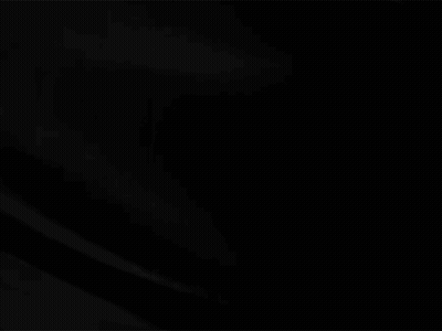A Close Up Of A Black Cloth Moving In The Wind On A Black Background . GIF