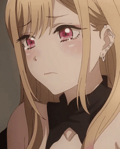A Close Up Of A Blonde Anime Girl With Red Eyes And A Piercing In Her Ear GIF