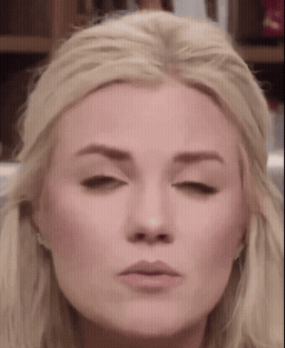 A Close Up Of A Blonde Woman Making A Funny Face GIF