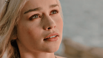 A Close Up Of A Blonde Woman 'S Face With Blue Eyes GIF