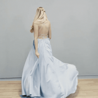 A Close Up Of A Blue And White Lace Fabric With Gino Cornell Written On The Bottom GIF