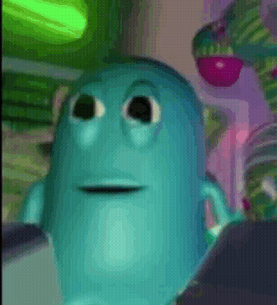 A Close Up Of A Blue Cartoon Character With Big Eyes And A Smile On His Face . GIF