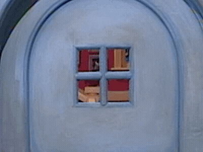 A Close Up Of A Blue Door With A Window In It GIF