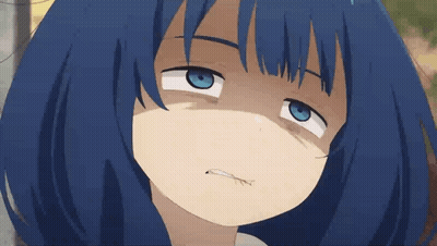 A Close Up Of A Blue Haired Anime Girl Making A Funny Face GIF
