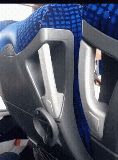 A Close Up Of A Blue Seat With A Handle GIF