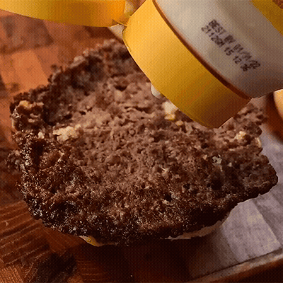 A Close Up Of A Bottle Of Mayonnaise On A Piece Of Bread GIF