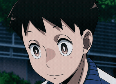 A Close Up Of A Boy 'S Face With A Blue Shirt GIF