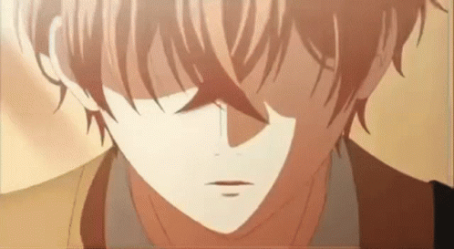A Close Up Of A Boy 'S Face With A Tear Coming Out Of His Eye . GIF