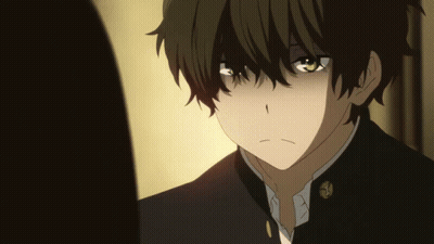 A Close Up Of A Boy With Green Eyes And A Black Jacket GIF