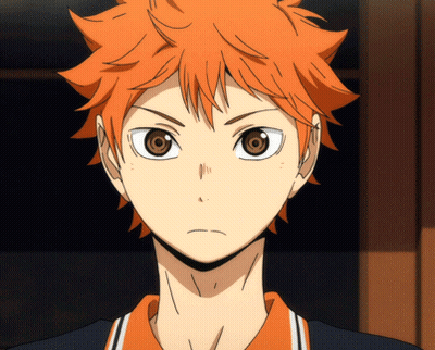 A Close Up Of A Boy With Orange Hair And Brown Eyes GIF