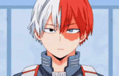 A Close Up Of A Boy With Red And White Hair And Blue Eyes . GIF