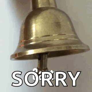 A Close Up Of A Brass Bell With The Word Sorry Written On It . GIF