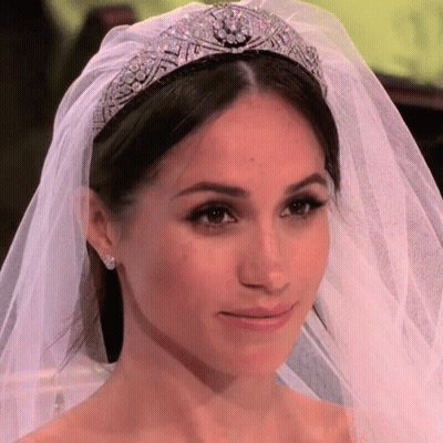 A Close Up Of A Bride Wearing A Veil And A Tiara GIF