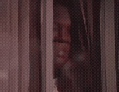A Close Up Of A Brown Curtain With A White Stripe GIF