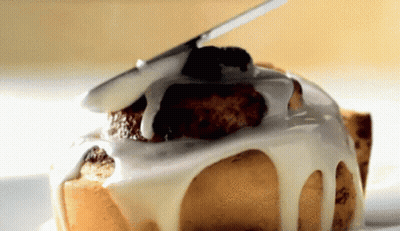 a close up of a cake with icing on it