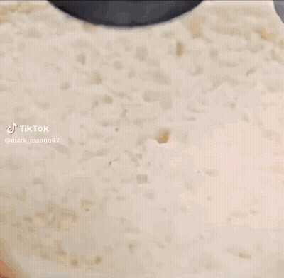 A Close Up Of A Cake With Ketchup And Mustard On Top GIF