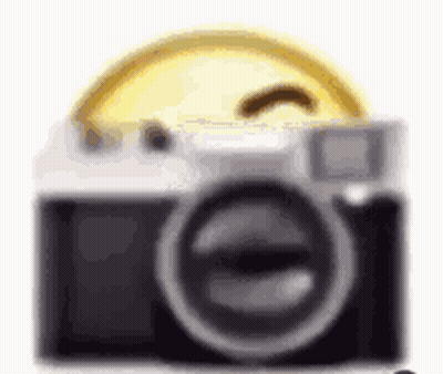 A Close Up Of A Camera With A Smiley Face On Top Of It . GIF