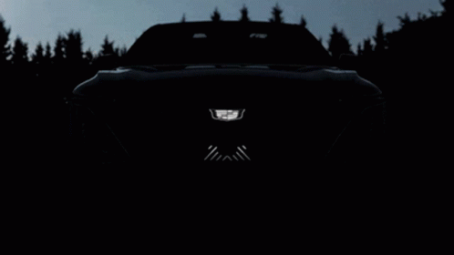 A Close Up Of A Car 'S Front Bumper With A Cadillac Logo On It GIF