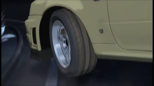 A Close Up Of A Car 'S Wheel With A Badge On The Side GIF