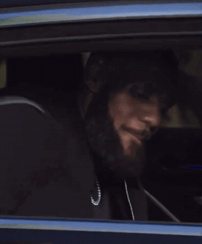 A Close Up Of A Car Window With A Person Looking Out GIF