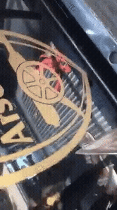 A Close Up Of A Car With A Logo That Says Arsenal On It GIF