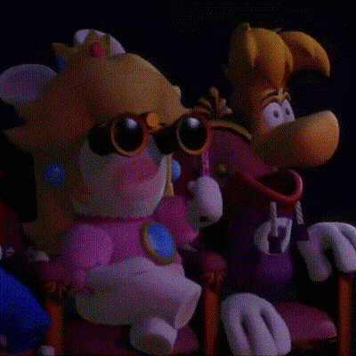 A Close Up Of A Cartoon Character , Peach , And Rayman , Standing Next To Each Other . GIF