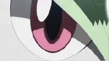 A Close Up Of A Cartoon Character 'S Eye With A Pink Ring Around It . GIF
