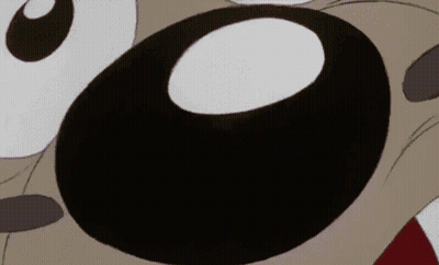 A Close Up Of A Cartoon Character 'S Eyes With A White Circle In The Middle GIF