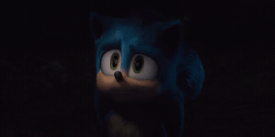 A Close Up Of A Cartoon Character 'S Face In The Dark GIF