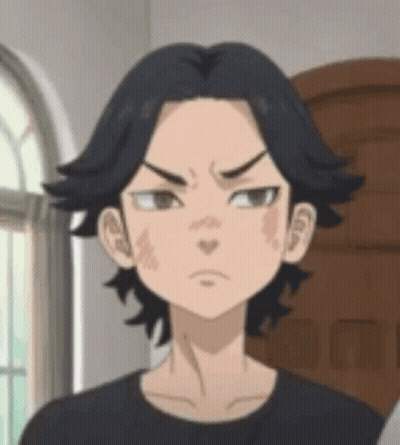 A Close Up Of A Cartoon Character 'S Face With A Black Shirt On . GIF
