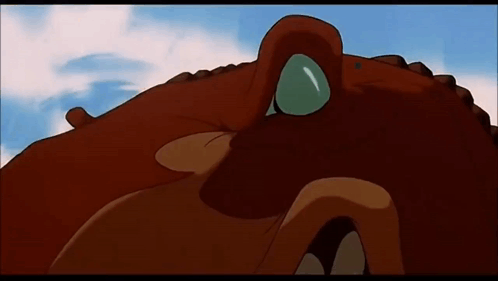 A Close Up Of A Cartoon Character 'S Face With A Blue Eye . GIF