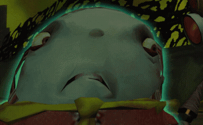 A Close Up Of A Cartoon Character 'S Face With A Green Light Behind It GIF