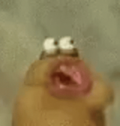 A Close Up Of A Cartoon Character 'S Face With A Mouth Open . GIF