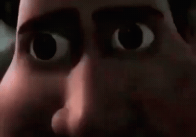 A Close Up Of A Cartoon Character 'S Face With Big Eyes And A Mouth Open . GIF