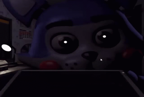 A Close Up Of A Cartoon Character 'S Face With Glowing Eyes And Teeth . GIF