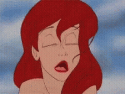 A Close Up Of A Cartoon Character 'S Face With Red Hair . GIF