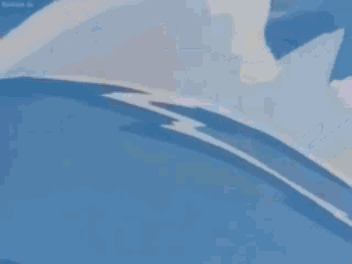 A Close Up Of A Cartoon Character 'S Face With Snow Falling On It 'S Head . GIF