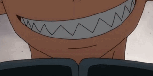 A Close Up Of A Cartoon Character 'S Mouth With Sharp Teeth And A Smile . GIF